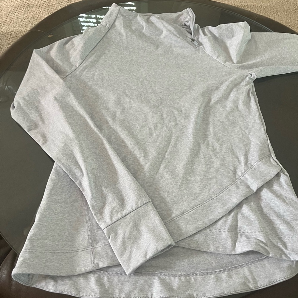 Athletic top-never worn but has a small hole under left arm looks to be a defect